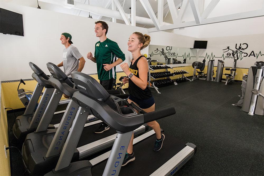 Students jog on treadmills in the CU Active Fitness Center.